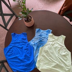 Three Lululemon high neck tanks